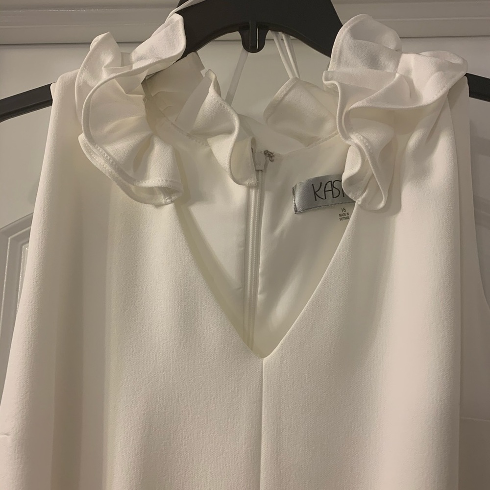 Kasper ivory sheath dress with ruffled collar.